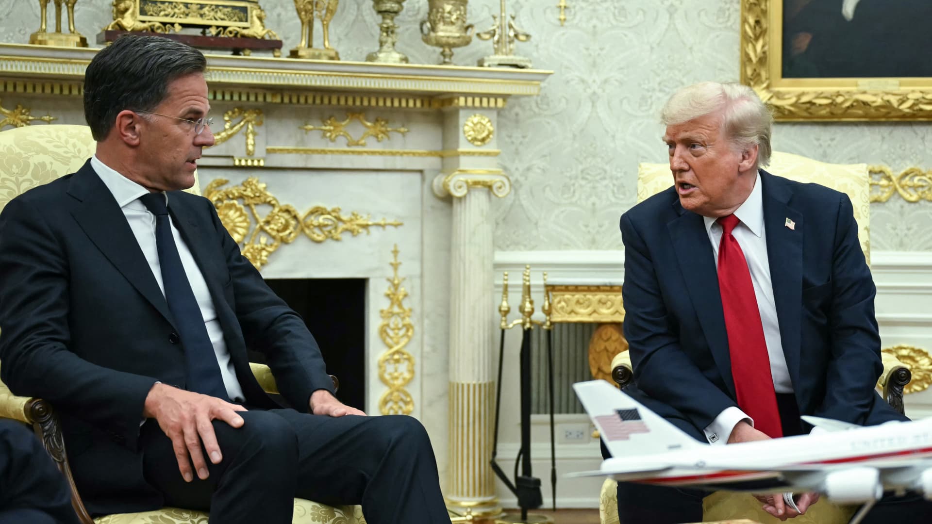 Trump brandishes tariffs for peace, not a trade war