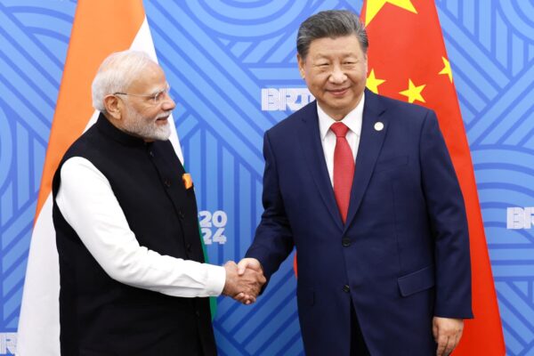 China’s Xi and India’s Modi meet, vow to resolve border differences