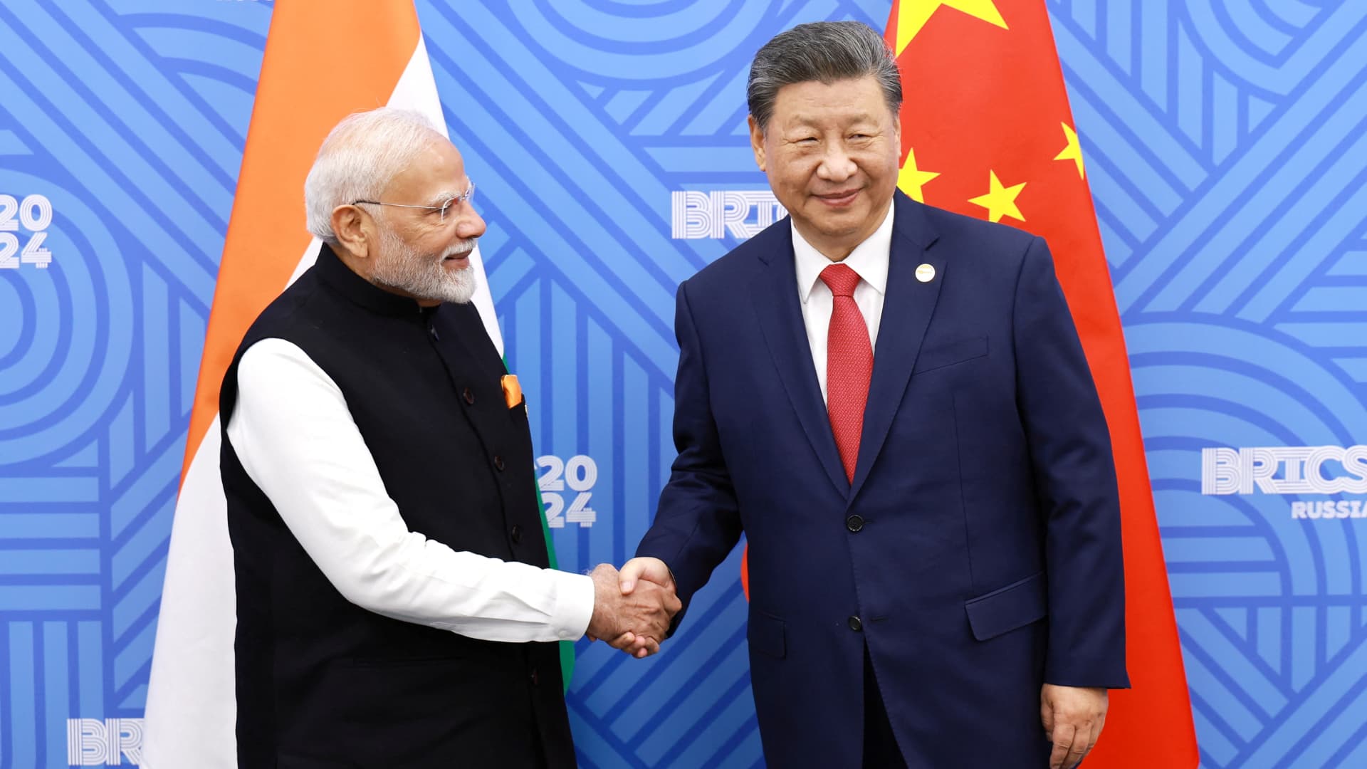 China’s Xi and India’s Modi meet, vow to resolve border differences