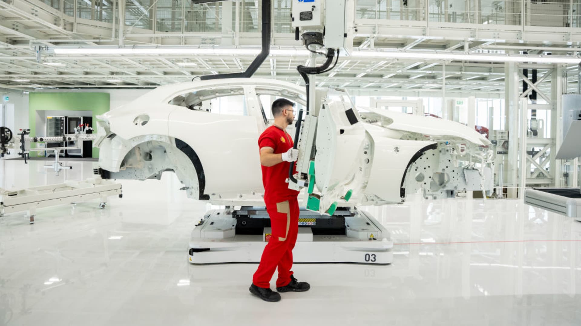 Ferrari unveils first electric vehicle and cuts 2030 EV sales target Ferrari unveils first electric vehicle and cuts 2030 EV sales target