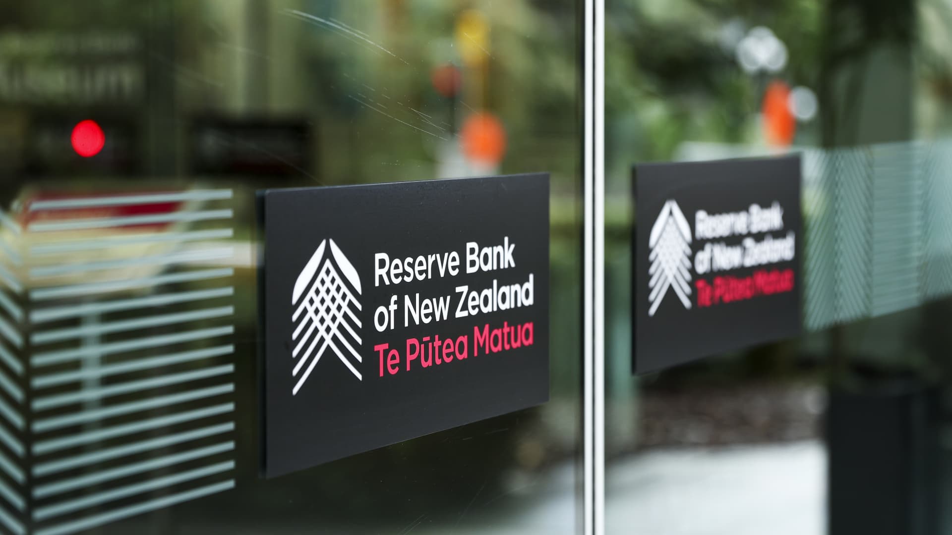 New Zealand central bank cuts rates to over 3-year low, signals end to easing cycle