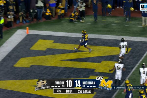 Jordan Marshall rushes 9 yards through the pile to extend Michigan’s lead over Purdue