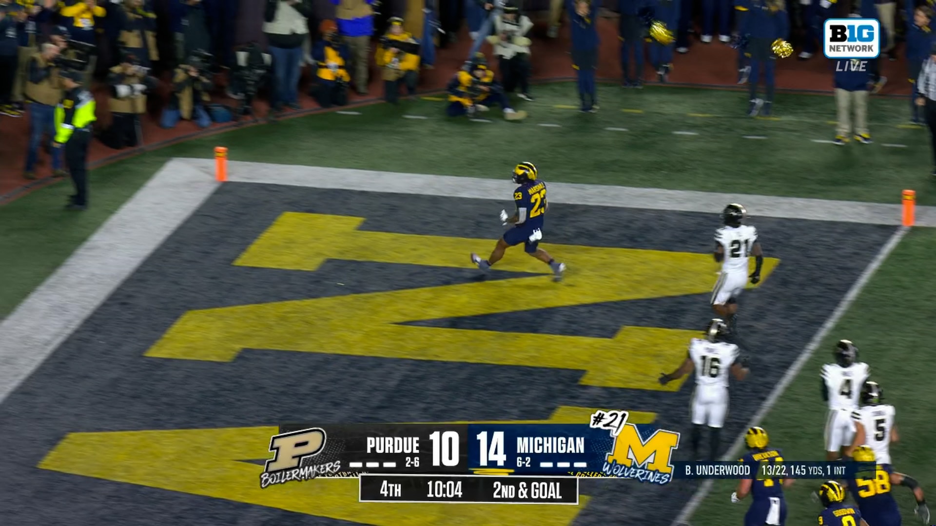 Jordan Marshall rushes 9 yards through the pile to extend Michigan’s lead over Purdue