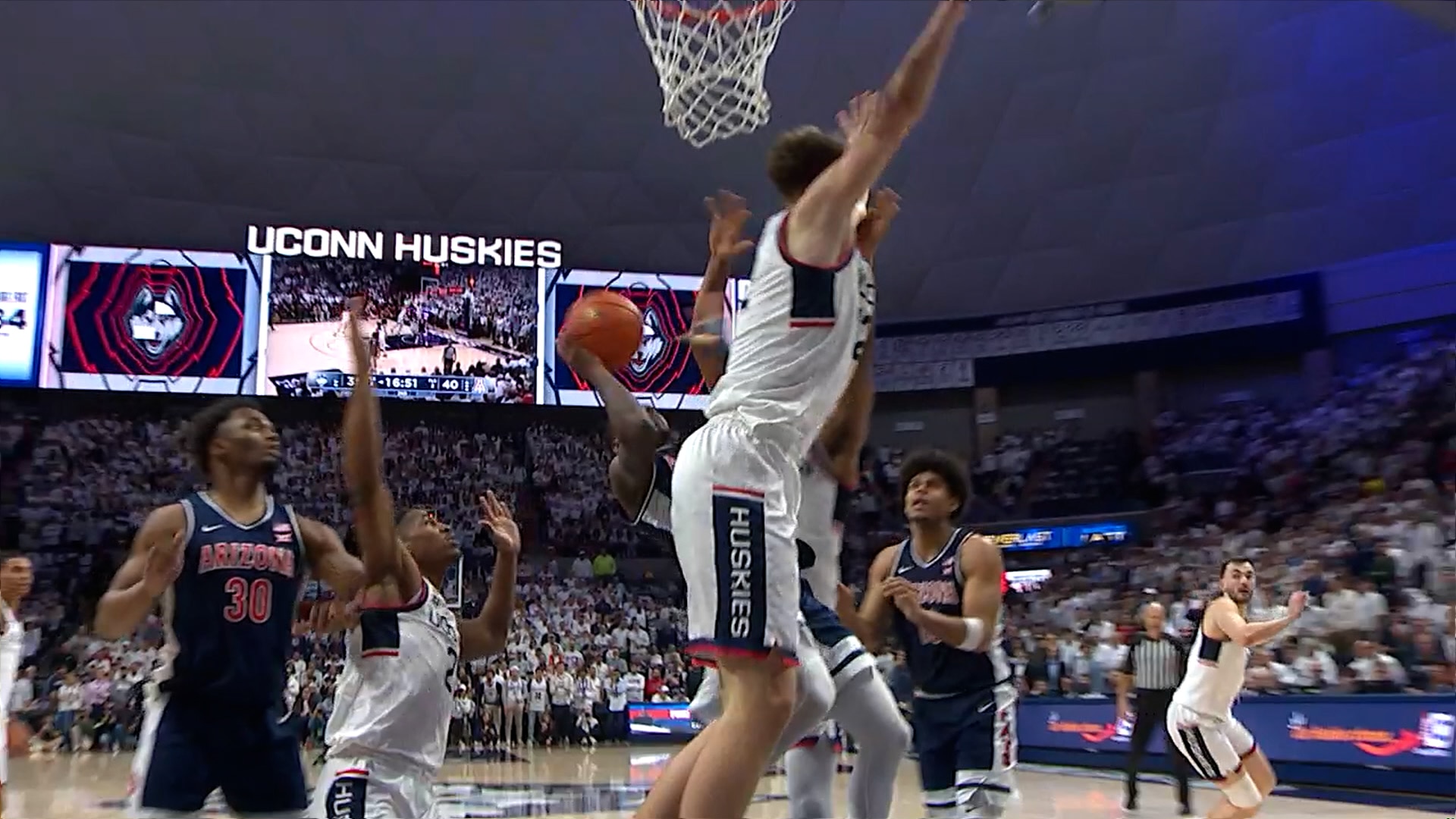 Jaden Bradley drives left and finishes TOUGH and-1, increasing Arizona's lead over UConn