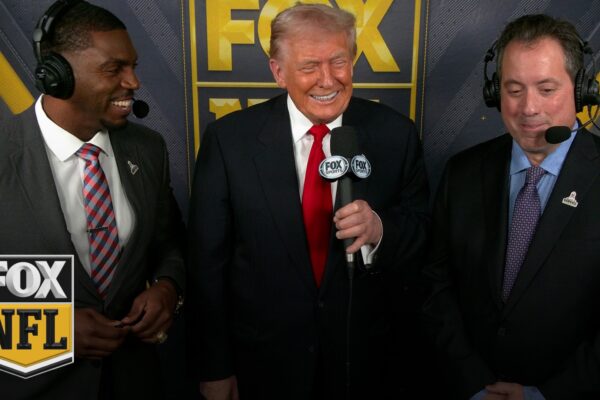 President Donald Trump joins Kenny Albert and Jonathan Vilma in the broadcast booth in Washington