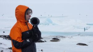 On the world’s coldest stage, a military musician plays with a plastic horn and double gloves