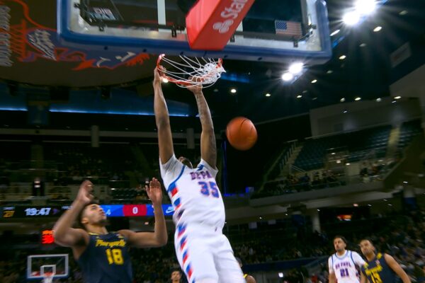 DePaul's N.J. Benson goes FLYING for fastbreak alley oop vs. Marquette
