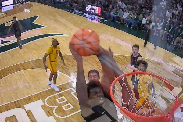 Michigan States' Coen Carr Posterizes Defender with Slam Dunk vs. USC