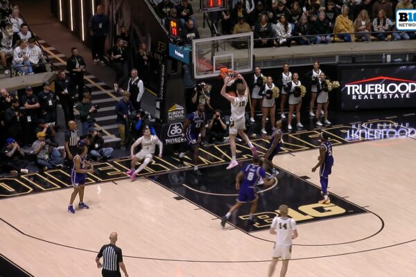 Braden Smith sets up Daniel Jacobsen for an alley-oop dunk again, extending Purdue's lead over Washington