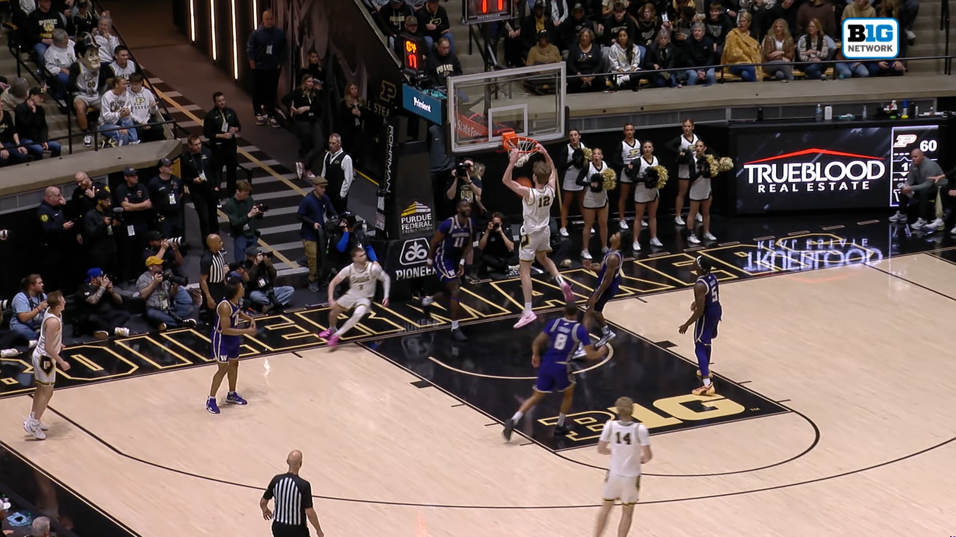 Braden Smith sets up Daniel Jacobsen for an alley-oop dunk again, extending Purdue's lead over Washington