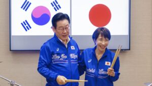 Japanese and South Korean leaders jam to K-pop hits at a summit