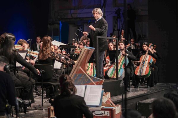 Milan prison hosts concert with instruments made by inmates from migrant smugglers’ boats