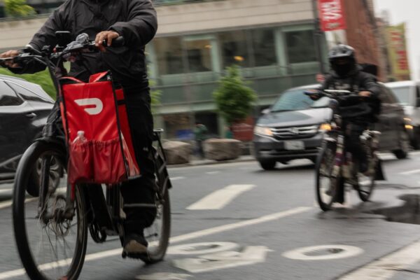 Stocks making the biggest moves midday: DASH, HOOD, AVGO, SNDK