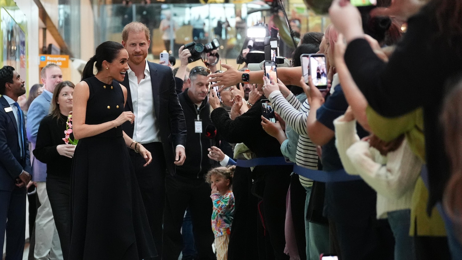 Prince Harry and Meghan arrive in Australia for a low-key, privately funded visit
