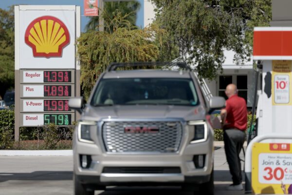 Car payments squeeze Americans as auto debt hits .68 trillion: Report